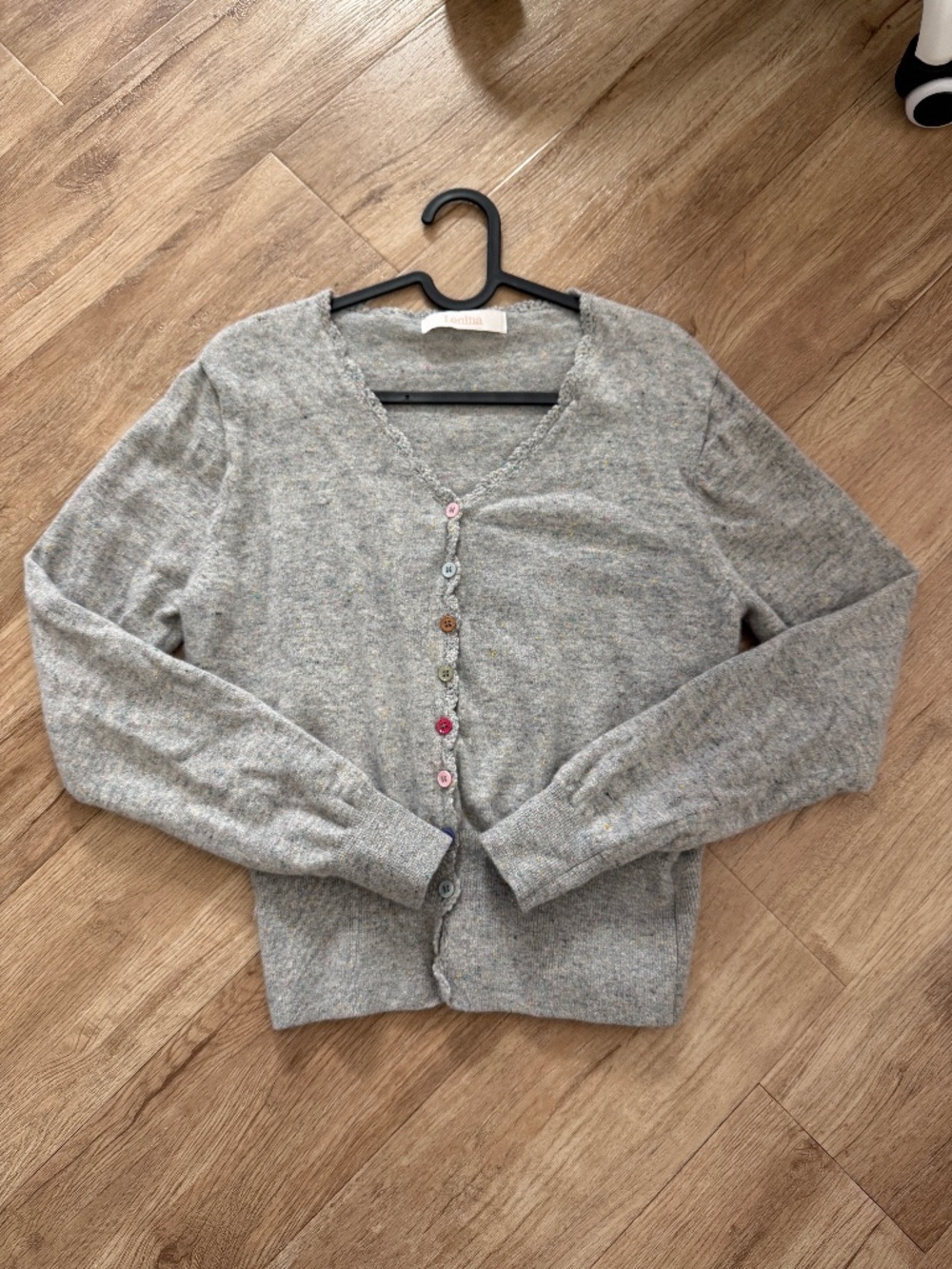 gray cardigan with colorful buttons